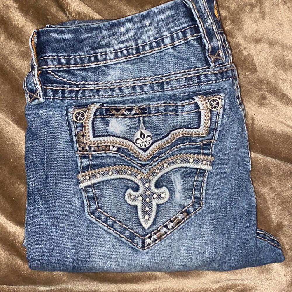 Rock revival, raven, ankle skinny jeans! Diamonds on back pockets